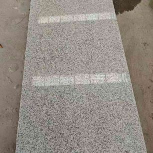 辽阳芝麻白光面毛板